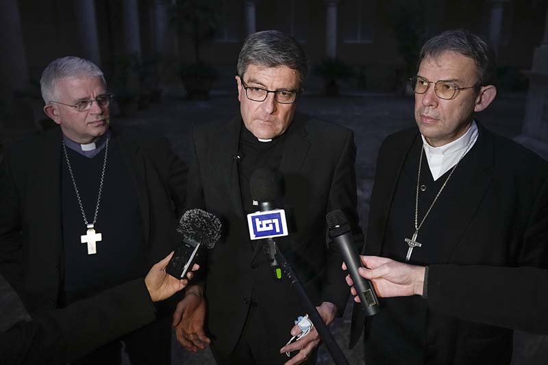From left, Mons. Olivier Leborgne, Bishop of Arras and Vice-President of the French bishops' conference, Mons. Eric de Moulins-Beaufort, Archbishop of Reims and President of the French conference of bishops, and Monsignor Dominique Blanchet, Bishop of Creteil, talk to reporters at the end of a press conference, in Rome, Monday, Dec. 13, 2021. Pope Francis agreed Monday to meet with the commission that published a ground-breaking report into clergy sexual abuse in the French Catholic Church and expressed "sadness" over the sudden downfall of the archbishop of Paris, accused of inappropriate relations with a woman and of governance problems. (AP Photo/Andrew Medichini)