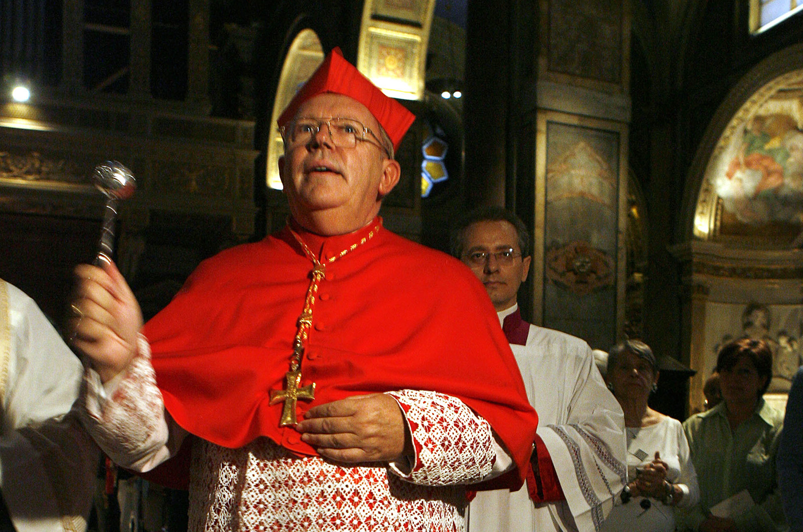 FILE - Archbishop of Bordeaux, France, Cardinal Jean-Pierre Bernard Ricard blesses his titular church — Sant' Agostino — during a ceremony to officially take possession of his church, in Rome, Sunday, Oct. 8, 2006. Cardinal Jean-Pierre Ricard said on Monday, Nov. 7, 2022 that he had abused a 14-year-old girl 35 years ago and is withdrawing from his functions. The move comes after a report issued last year revealed a large number of child sex abuse cases within the country's Catholic Church. (AP Photo/Andrew Medichini, File)