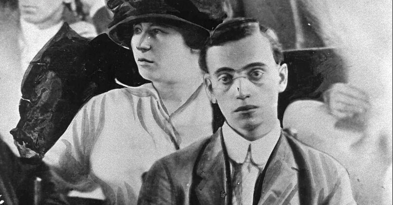 Leo Frank during his trial in 1913. His wife, Lucille, sits behind him. Edited image courtesy of Wikipedia/Creative Commons