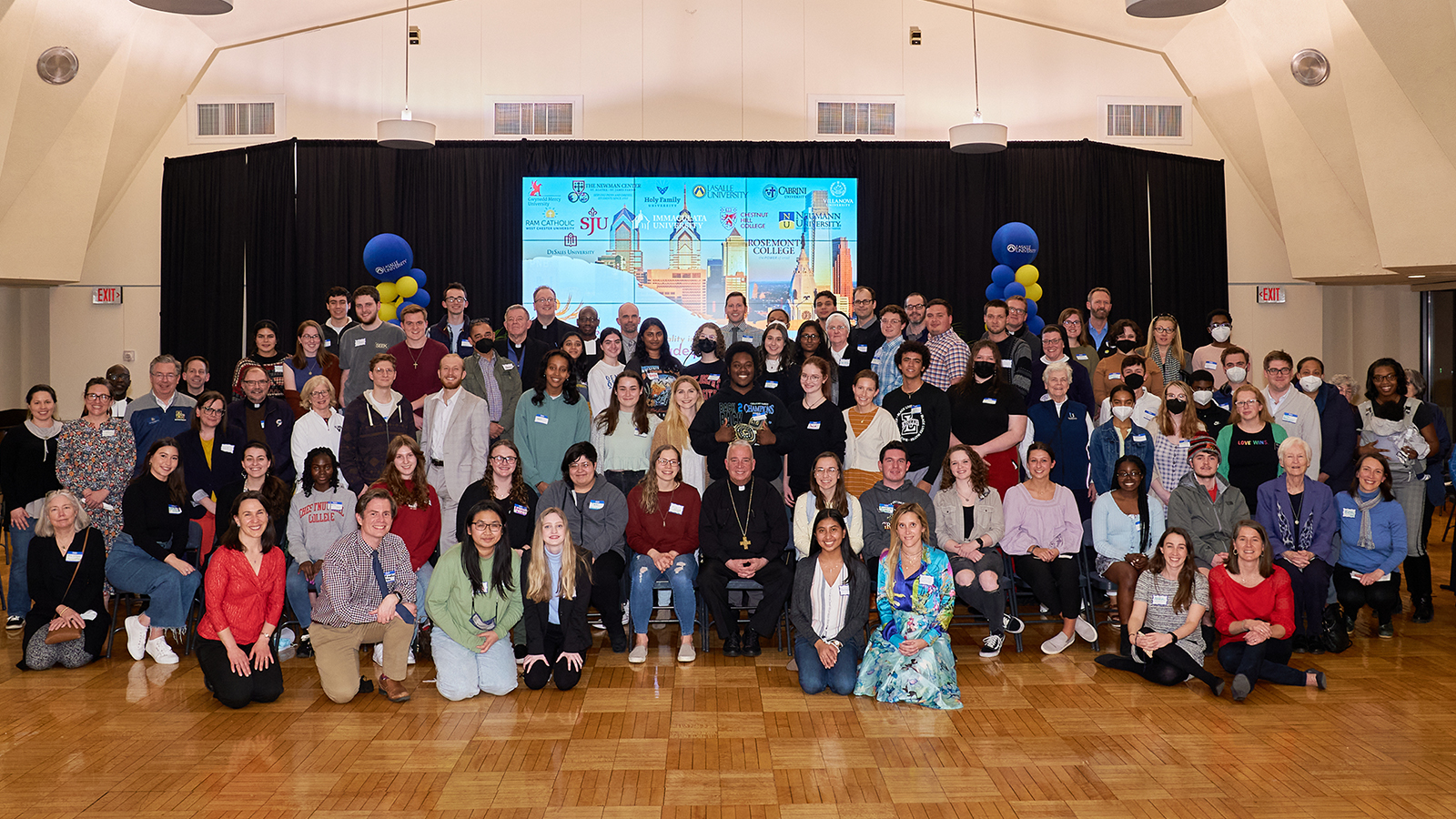 Philadelphia Archbishop Nelson Perez, center bottom, poses with young adults and students during a Synod on Synodality listening session hosted at La Salle University in Philadelphia on April 4, 2022. Photo by Dan Nguyen/La Salle University