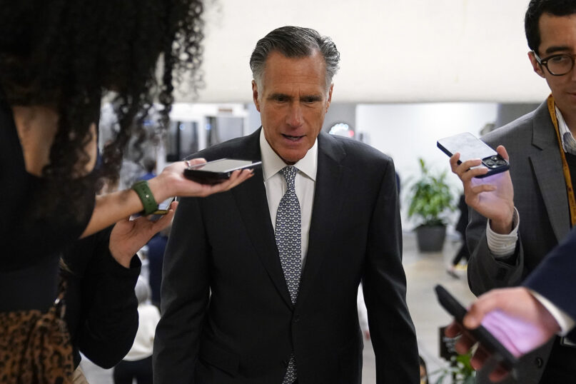 Sen. Mitt Romney, R-Utah, speaks with members of the press before voting on a bill that would enshrine same-sex and interracial marriages into federal law, Nov. 16, 2022, on Capitol Hill in Washington. (AP Photo/Patrick Semansky)