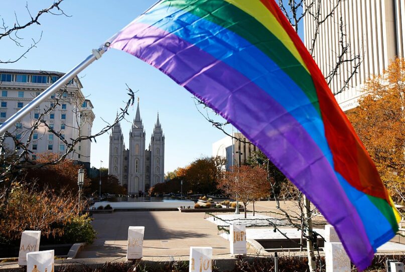 A pride flag flies in front of the historic temple of the Church of Jesus Christ of Latter-day Saints in Salt Lake City, Utah. (George Frey/Getty Images)