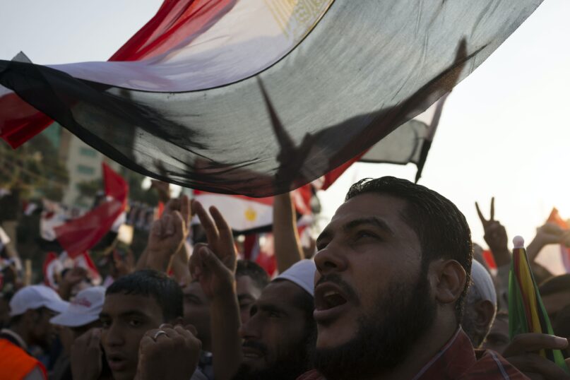 Members of the Muslim Brotherhood protest at a rally in 2013. (Carsten Koall/Getty Images)
