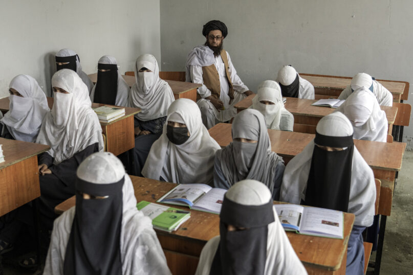 Afghan girls attend a religious school that remained open since last year’s Taliban takeover, in Kabul, Afghanistan, Aug 11, 2022. The country’s Taliban rulers ordered women nationwide to stop attending private and public universities in December 2022. The Taliban also banned girls from middle school and high school, barred women from most fields of employment and ordered them to wear head-to-toe clothing in public. Women are also banned from parks and gyms. (AP Photo/Ebrahim Noroozi, File)