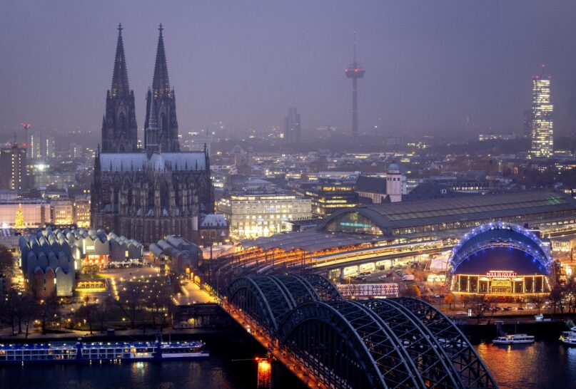 The illuminated city center with the Cathedral in Cologne, Germany, Tuesday, Nov. 29, 2022. (AP Photo/Michael Probst)