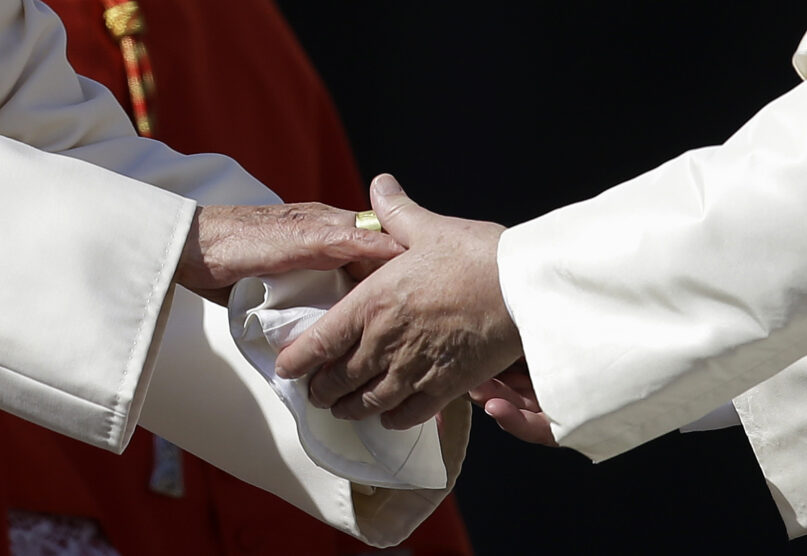 FILE - Pope Francis, right, greets Pope Emeritus Benedict XVI at the end of a meeting with elderly faithful in St. Peter's Square at the Vatican, on Sept. 28, 2014. Pope Benedict XVI’s 2013 resignation sparked calls for rules and regulations for future retired popes to avoid the kind of confusion that ensued. Benedict, the German theologian who will be remembered as the first pope in 600 years to resign, has died, the Vatican announced Saturday Dec. 31, 2022. He was 95. (AP Photo/Gregorio Borgia, File)