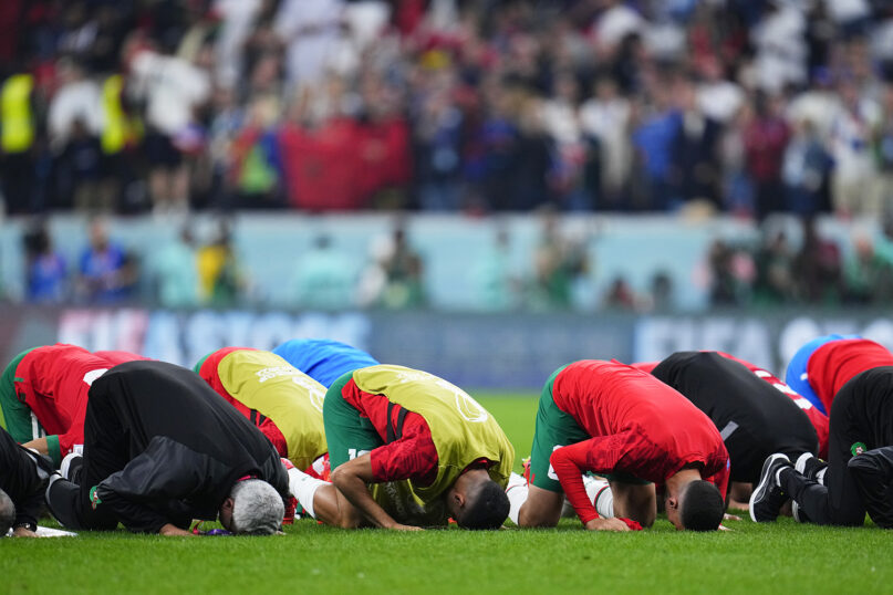 Players of Morocco kneel in sujood prayer after their 0-2 loss against France in a World Cup semifinal soccer match at the Al Bayt Stadium in Al Khor, Qatar, Thursday, Dec. 15, 2022. (AP Photo/Natacha Pisarenko)