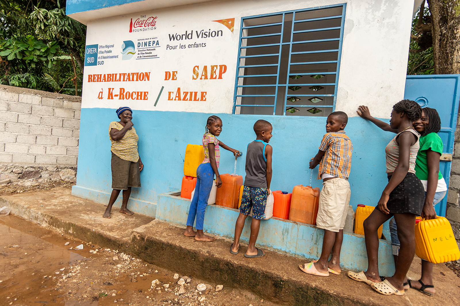 People collect clean water at a station sponsored by World Vision. Photo courtesy of World Vision