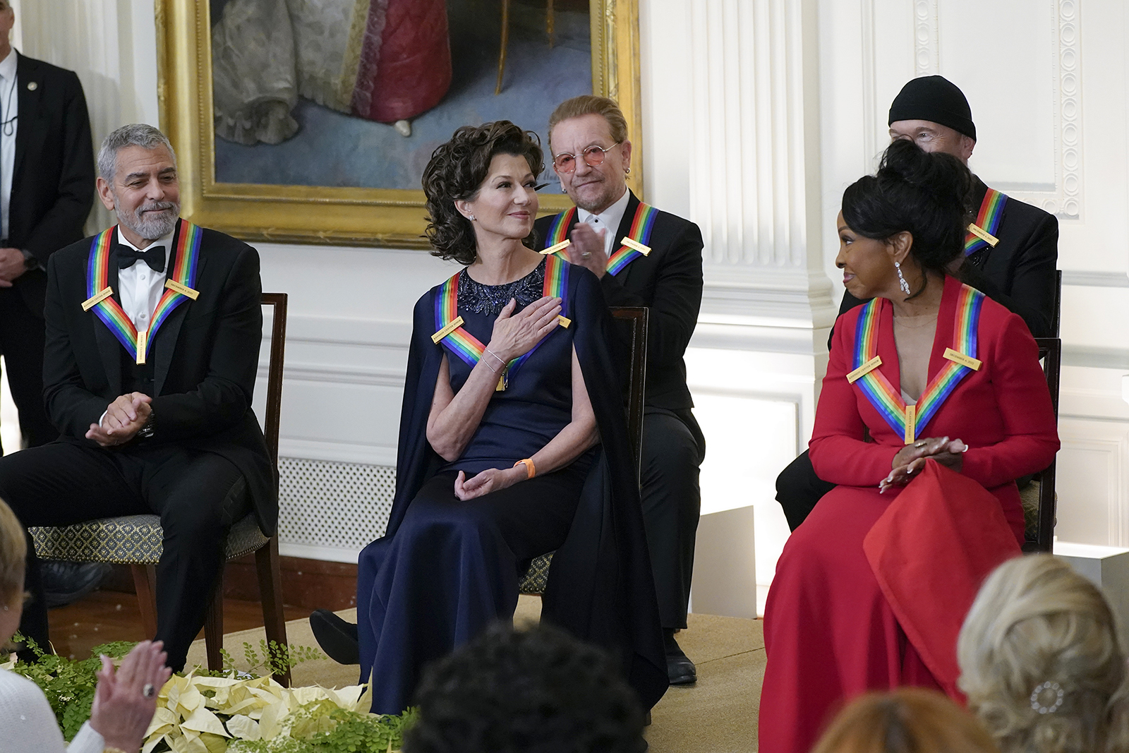 Contemporary Christian singer Amy Grant, center, reacts as she is recognized by President Joe Biden during the Kennedy Center honorees reception at the White House in Washington, Sunday, Dec. 4, 2022. The 2022 Kennedy Center Honorees include from left, George Clooney, Amy Grant, Bono, Gladys Knight, and The Edge. (AP Photo/Manuel Balce Ceneta)