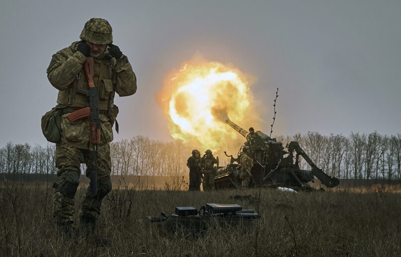Ukrainian soldiers fire a Pion artillery system at Russian positions near Bakhmut, Donetsk region, Ukraine, Friday, Dec. 16, 2022. (AP Photo/LIBKOS)