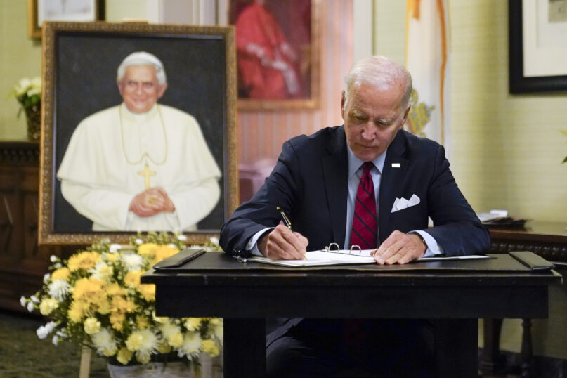 President Joe Biden signs a condolence book at the Apostolic Nunciature of the Holy See in Washington, Thursday, Jan. 5, 2023, for Pope Emeritus Benedict XVI. Benedict died at 95 on Dec. 31, 2022, in the monastery on the Vatican grounds where he had spent nearly all of his decade in retirement. (AP Photo/Patrick Semansky)