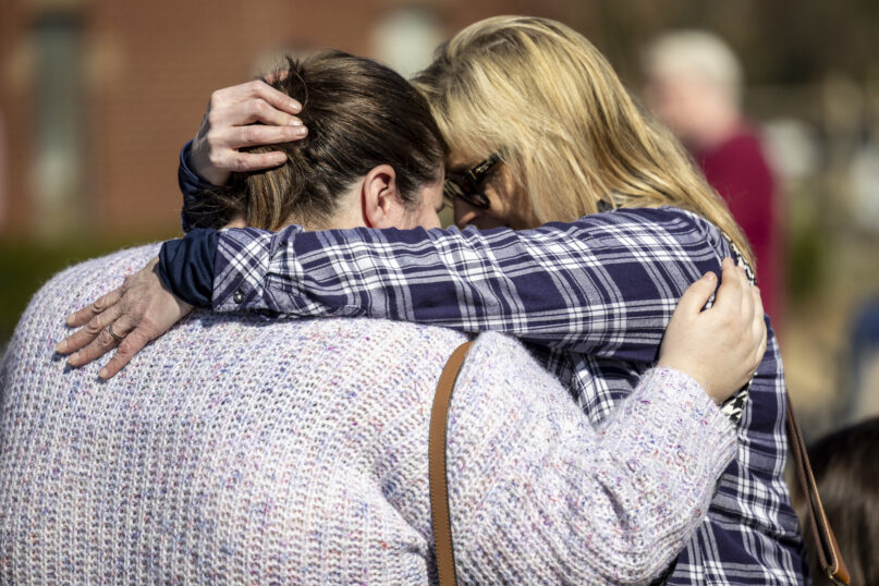 Kerry Fulford, right, embraces Shana Latham, offering words of comfort at Crosspoint Christian Church following a tornado several days earlier in Selma, Ala., Sunday, Jan. 15, 2023. Latham was one of the teachers who acted quickly to move children into safe interior rooms as the tornado caused heavy damage at the church's preschool building. (AP Photo/Vasha Hunt)