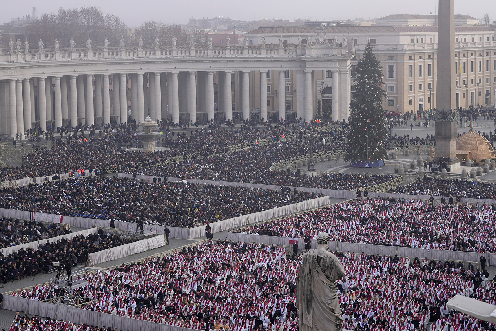 Faithful attend the funeral mass for Emeritus Pope Benedict XVI in St. Peter's Square at the Vatican, Thursday, Jan. 5, 2023. (AP Photo/Ben Curtis)