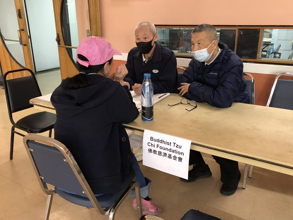 Representatives with the Buddhist Tzu Chi Foundation, right, work at a crisis response center in Monterey Park, Calif., Tuesday, Jan. 24, 2023, following a mass shooting in the community. Photo courtesy of Tzu Chi USA