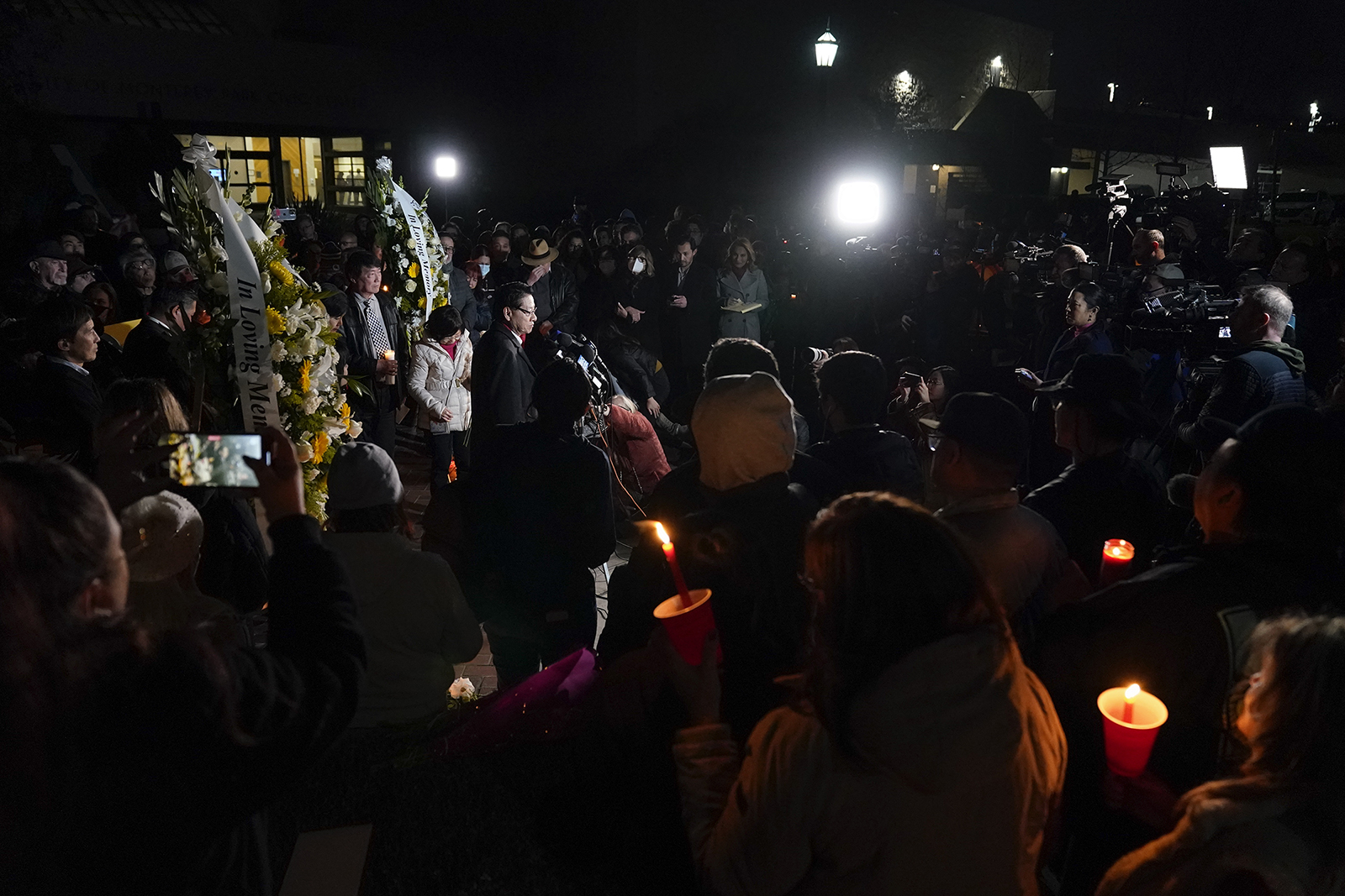 People gather for a vigil honoring the victims of a mass shooting at Star Ballroom Dance Studio, Monday, Jan. 23, 2023, in Monterey Park, Calif. A gunman killed multiple people late Saturday amid Lunar New Year's celebrations in the predominantly Asian American community. (AP Photo/Ashley Landis)