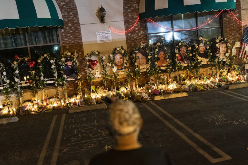 A man visits a memorial outside Star Dance Studio in Monterey Park, Calif., Thursday, Jan. 26, 2023. Those killed by a gunman who opened fire at the dance hall are being remembered by friends and family for the zest for life that brought them out that night to celebrate the Lunar New Year. (AP Photo/Jae C. Hong)