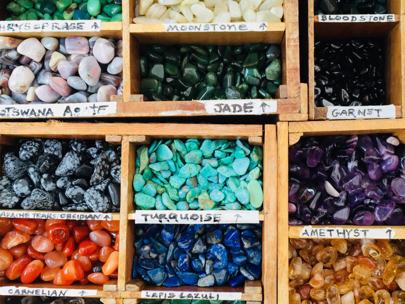 Assorted crystals and precious stones for sale at a store. Photo by Emily Karakis/Unsplash/Creative Commons