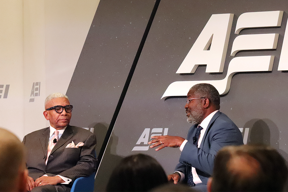 The Rev. Eugene F. Rivers III, left, and Ian Rowe speak at the American Enterprise Institute on Friday, Jan. 6, 2023, in Washington. RNS photo by Adelle M. Banks