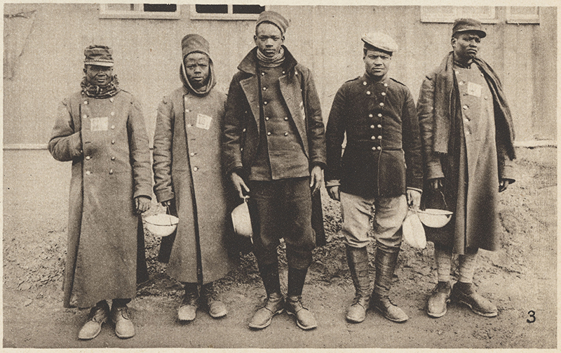 Photograph of North African French colonial prisoners of war at Halbmondlager, "Half Moon Camp," in Wünsdorf, Germany, in 1915. (Print, Photograph from periodical “Der Grosse Krieg in Bildern,” No. 4. 1915. Germany. 2007.68.4. National WWI Museum and Memorial.)