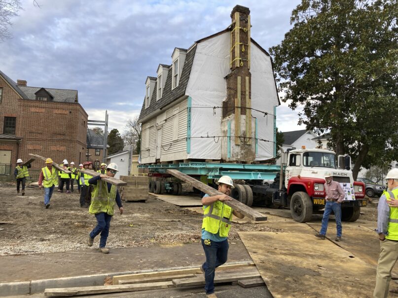 Workers prepare to move the original structure that held what is believed to be the oldest schoolhouse in the U.S. for Black children in Williamsburg, Virginia, on Friday, Feb. 10, 2023. (AP Photo/ Ben Finley)