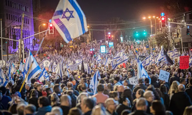 Protestors in the streets of Tel Aviv. Photograph: Eyal Warshavsky/Sopa Images/Rex/Shutterstock