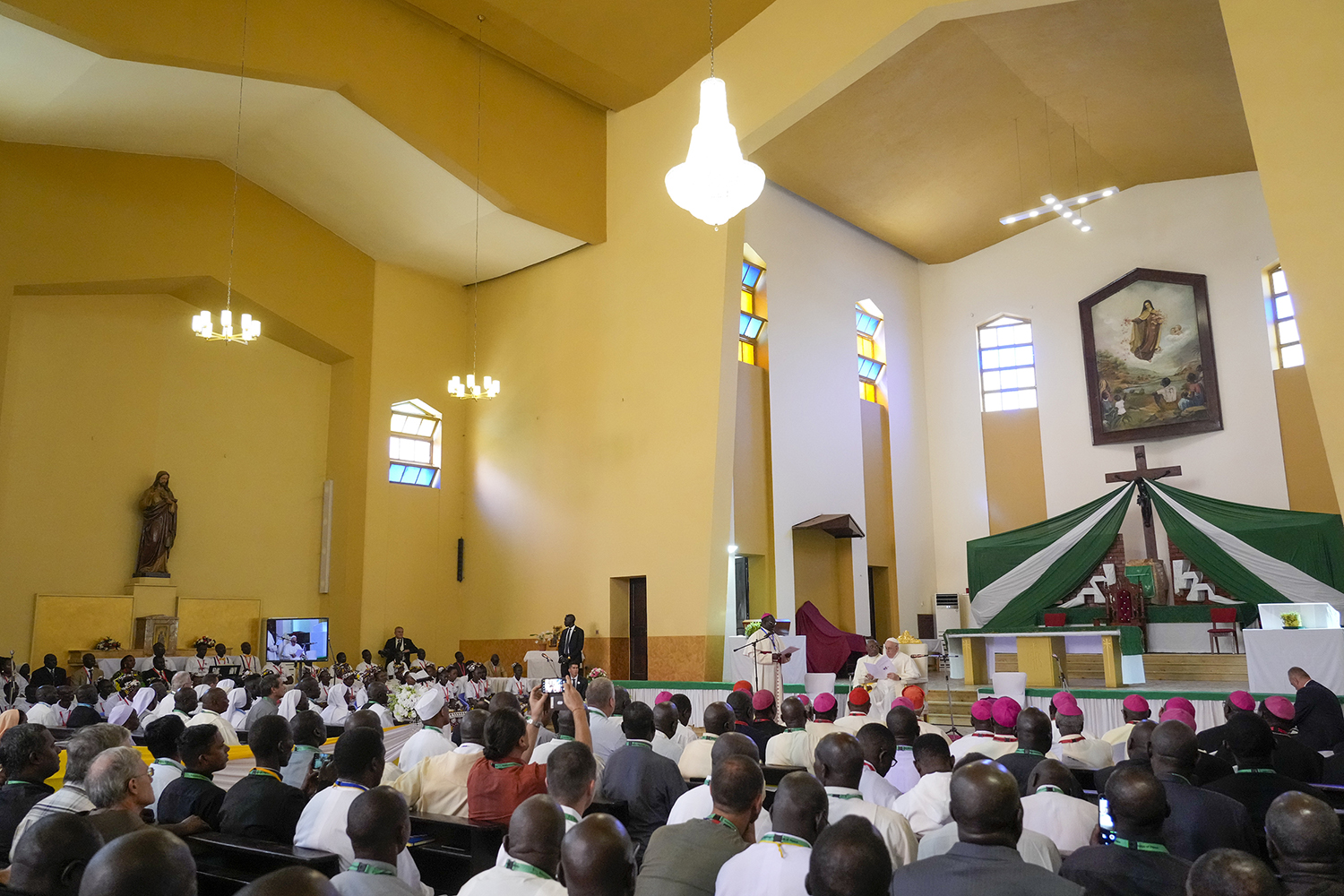 Pope Francis delivers his speech as he meets with priests, deacons, consecrated people and seminarians at the Cathedral of Saint Theresa in Juba, South Sudan, Saturday, Feb. 4, 2023. Francis is in South Sudan on the second leg of a six-day trip that started in Congo, hoping to bring comfort and encouragement to two countries that have been riven by poverty, conflicts and what he calls a "colonialist mentality" that has exploited Africa for centuries. (AP Photo/Gregorio Borgia)