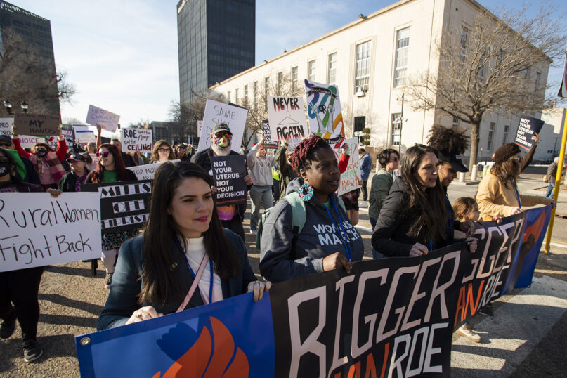 People march in front of the J. Marvin Jones Federal Building and Mary Lou Robinson United States Courthouse to protest a lawsuit to ban the abortion drug mifepristone, Feb. 11, 2023, in Amarillo, Texas. (AP Photo/Justin Rex)