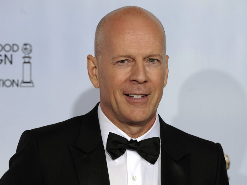 Presenter Bruce Willis poses during the Golden Globe Awards, Jan. 16, 2011, in Beverly Hills, California. (AP Photo/Mark J. Terrill)