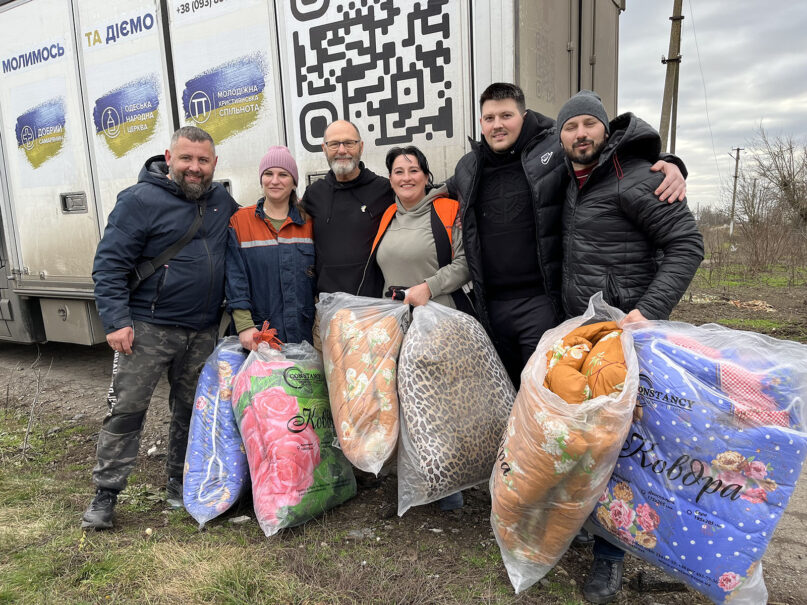 Ken Ward, third from left, poses with members of Odessa People's Church and aid recipients in Pervomayskoe Village on Jan. 19, 2023, in Ukraine. Photo courtesy of Ward