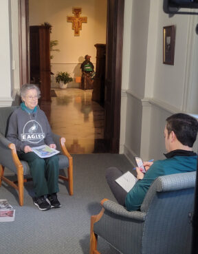 Sr. Nora Nash, OSF being interviewed by CBS3 News in her Eagle’s gear. Courtesy of Sisters of St. Francis of Philadelphia