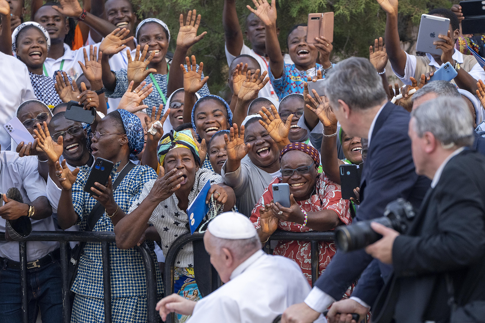 Pope Francis greets worshippers at Notre Dame du Congo Cathedral in Kinshasa, Congo, Thursday Feb. 2 2023. Francis is in Congo and South Sudan for a six-day trip, hoping to bring comfort and encouragement to two countries that have been riven by poverty, conflicts and what he calls a "colonialist mentality" that has exploited Africa for centuries. (AP Photo/Jerome Delay)