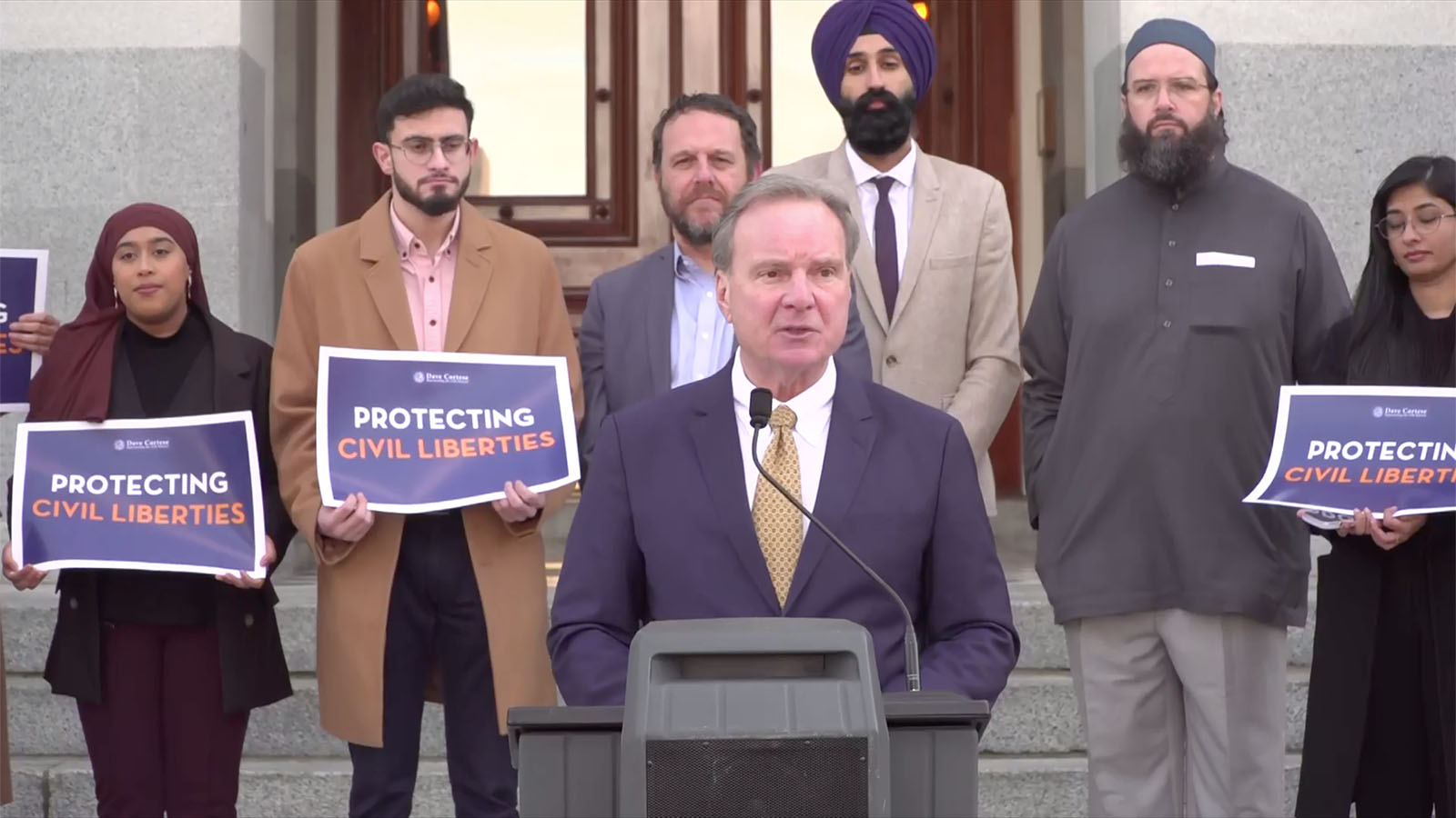 California State Senator Dave Cortese, joined by multi-faith leaders, unveils a bill that would create a statewide policy for religious clothing, headwear, and grooming practices among incarcerated individuals in state and local correctional and detention facilities, Monday, Feb. 6, 2023, in Sacramento, California. Video screen grab
