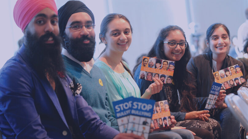 People display Sikh anti-bullying brochures. Photo courtesy Sikh Coalition