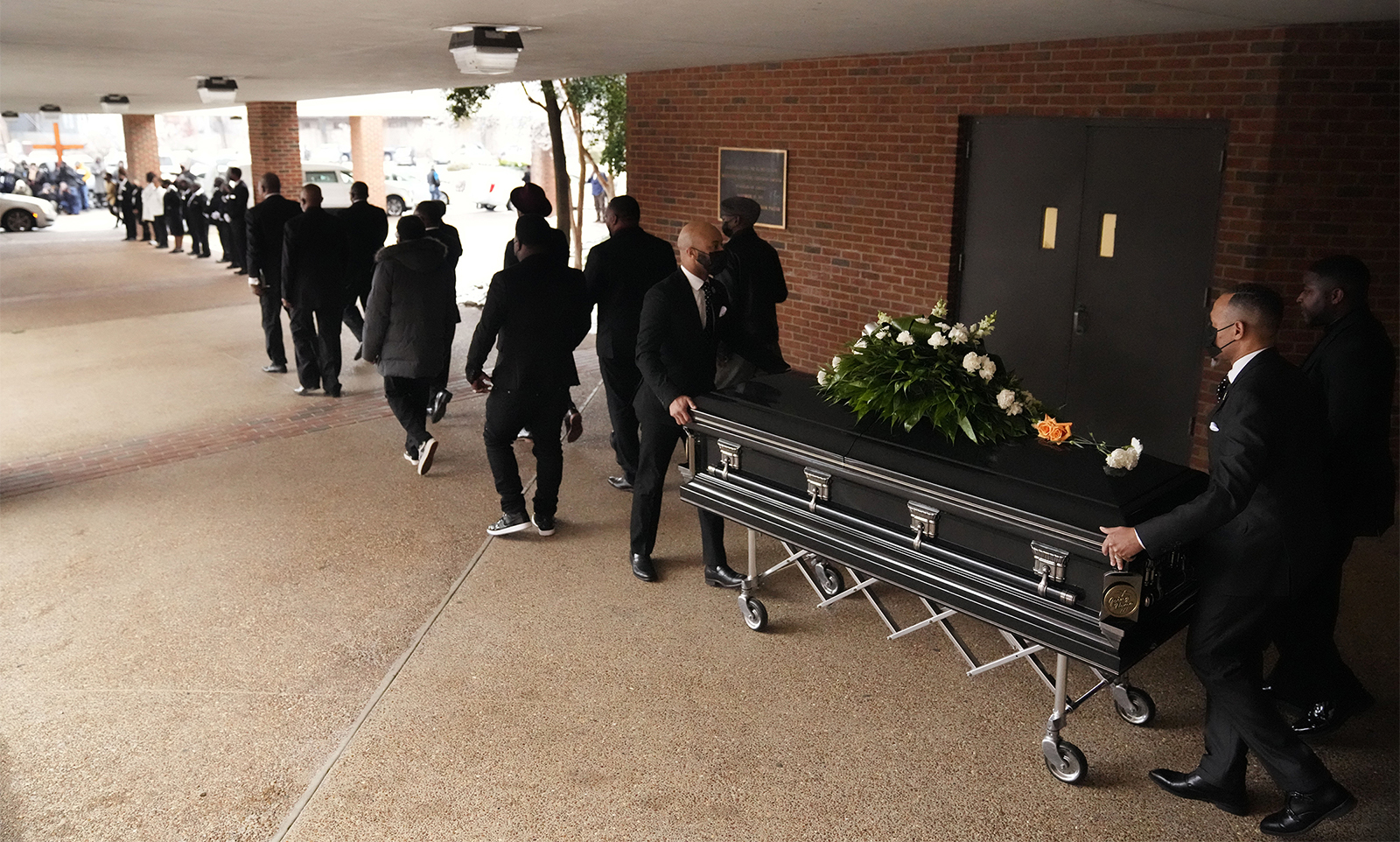 The remains of Tyre Nichols are escorted out of the Mississippi Boulevard Christian Church after the funeral service on Wednesday, Feb. 1, 2023, in Memphis, Tenn. Nichols was beaten by Memphis police officers, and later died from his injuries. (AP Photo/Jeff Roberson)