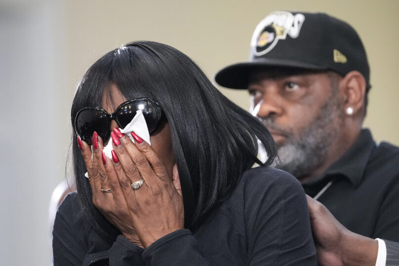 RowVaughn Wells, mother of Tyre Nichols, who died after being beaten by Memphis police officers, cries as she is comforted by Tyre's stepfather, Rodney Wells, at a news conference in Memphis, Tennessee, Jan. 23, 2023. (AP Photo/Gerald Herbert)