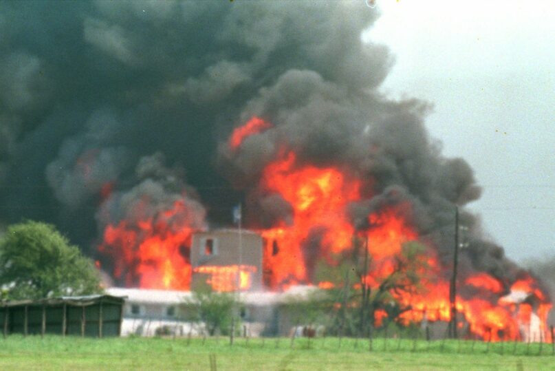 Fire engulfs the Branch Davidian compound near Waco, Texas, on April 19, 1993. (AP Photo/Ron Heflin)