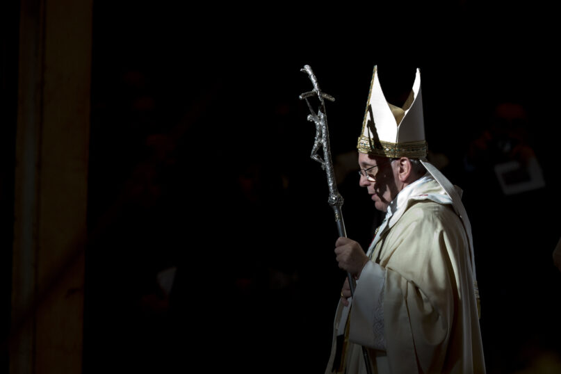 Pope Francis, holding the pastoral staff, leaves after celebrating a Mass in St. Peter's Basilica, at the Vatican, to mark Epiphany, Jan. 6, 2014. (AP Photo/Andrew Medichini, File)