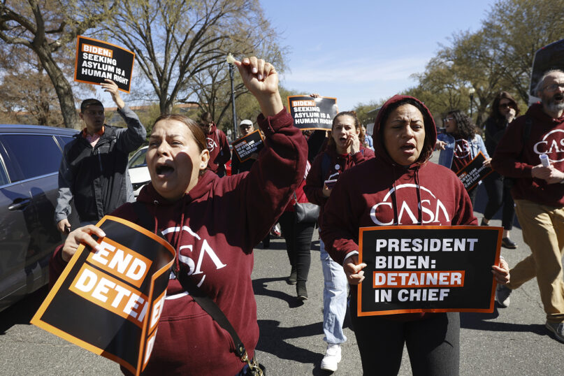 Activists march to the White House to rally against family detention and President Joe Biden's proposed asylum ban on March 16, 2023, in Washington. (Eric Kayne/AP Images for Movement Catalyst)