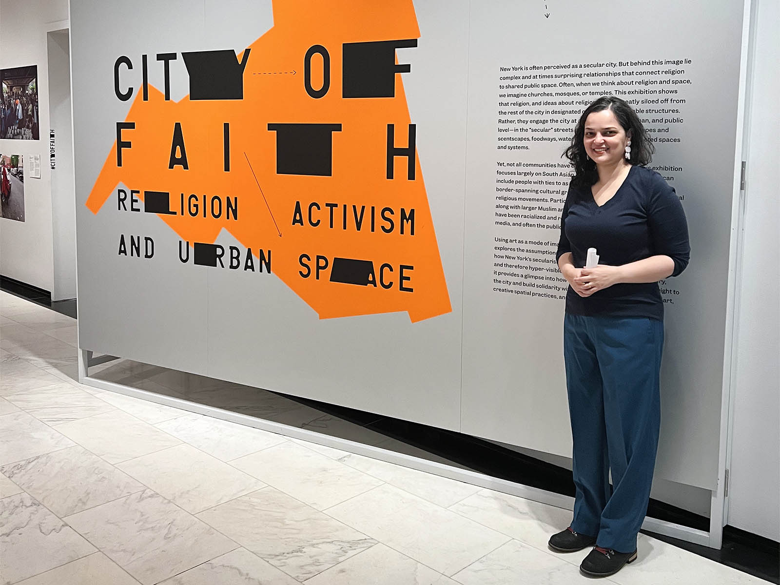 Curator Azra Dawood with the “City of Faith: Religion, Activism, and Urban Space" exhibit at the Museum of the City of New York. RNS photo by Kathryn Post
