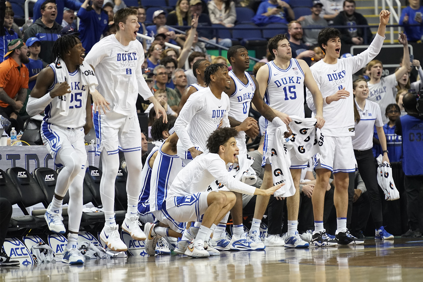 Duke players react to a teammate's basket during an NCAA college basketball game at the Atlantic Coast Conference Tournament in Greensboro, N.C., Thursday, March 9, 2023. (AP Photo/Chuck Burton)