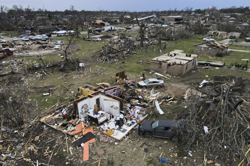 Debris is strewn about tornado-damaged homes, Sunday, March 26, 2023, in Rolling Fork, Mississippi. At least 25 people were killed and dozens of others were injured in Mississippi as the massive storm ripped through several towns late Friday. (AP Photo/Julio Cortez)