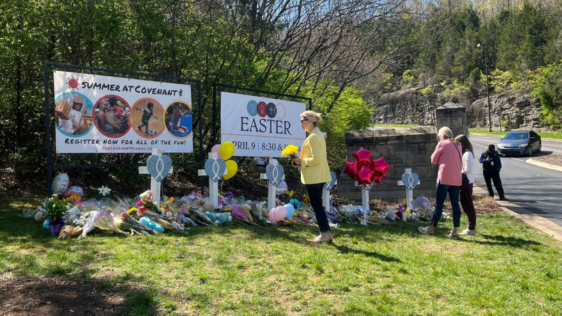 People pay respects at a memorial for the six people who were killed, at an entry to The Covenant School, March 29, 2023, in Nashville, Tennessee. RNS photo by Bob Smietana