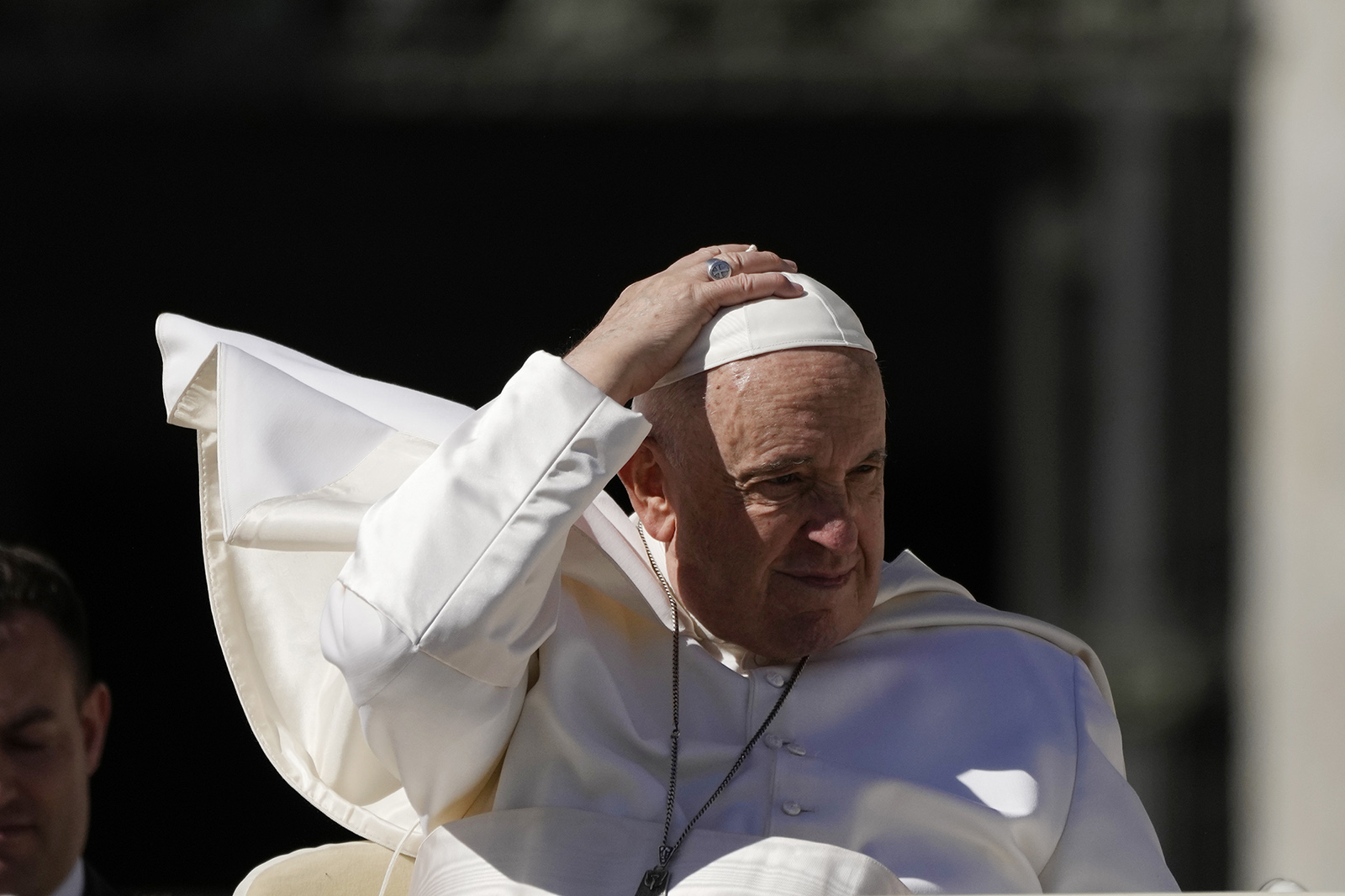 Pope Francis adjusts his skull cap at the end of his weekly general audience in St. Peter's Square at The Vatican, Wednesday, March 15, 2023. Francis passed his 10th anniversary as pope on March 13. (AP Photo/Alessandra Tarantino)