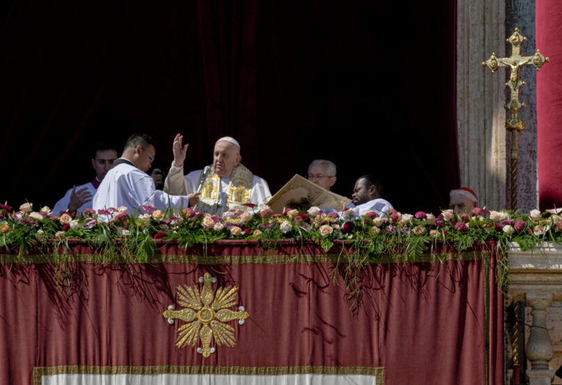 Pope Francis bestows the plenary 'Urbi et Orbi' (to the city and to the world) blessing from the central balcony of St. Peter's Basilica at the Vatican at the end of the Easter Sunday Mass, Sunday, April 9, 2023. (AP Photo/Alessandra Tarantino)