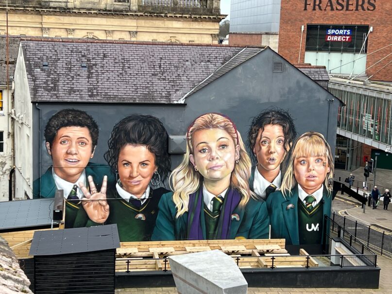 A mural in Derry commemorating the TV show 'Derry Girls,' which follows the lives of teenagers growing up amid Northern Ireland's troubles. (Dominic Bryan</span>, <a class=