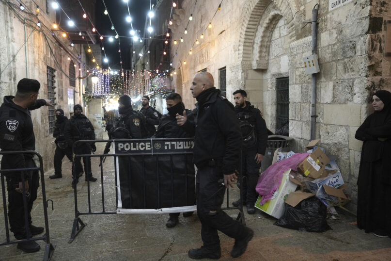 Israeli police close a path leading to the Al-Aqsa Mosque compound after shots were fired in the Old City of Jerusalem during the Muslim holy month of Ramadan, April 1, 2023. (AP Photo/ Mahmoud Illean)