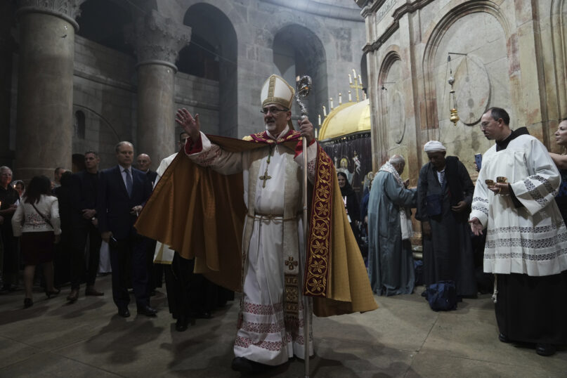 FILE - Latin Patriarch of Jerusalem Pierbattista Pizzaballa leads the Easter Sunday Mass at the Church of the Holy Sepulcher, where many Christians believe Jesus was crucified, buried and rose from the dead, in the Old City of Jerusalem, Sunday, April 9, 2023. (AP Photo/Mahmoud Illean, File)