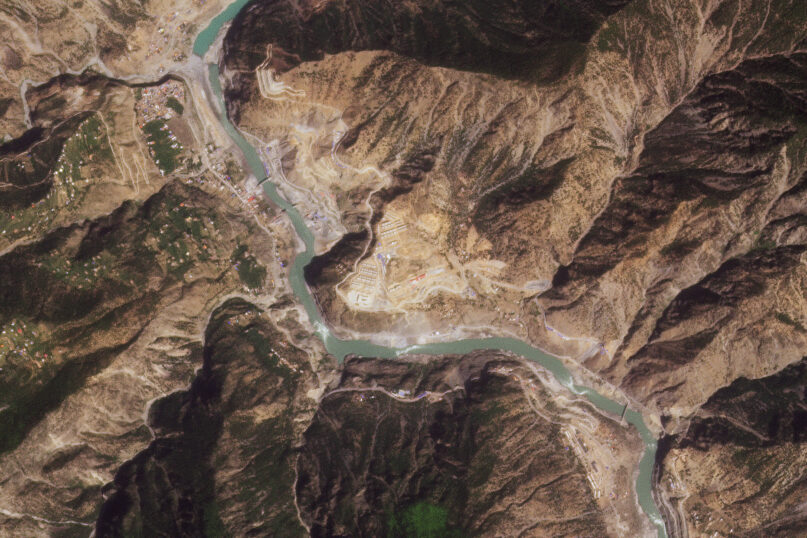 This satellite image from Planet Labs PBC shows the Dasu Dam project in Khyber Pakhtunkhwa province, Pakistan, Thursday, April 13, 2023. Pakistani police arrested a Chinese national working at the dam project on blasphemy charges after he allegedly insulted Islam and the Prophet Muhammad, authorities said Monday. Under Pakistan's controversial blasphemy laws, the offense carries the death penalty. (Planet Labs PBC via AP)