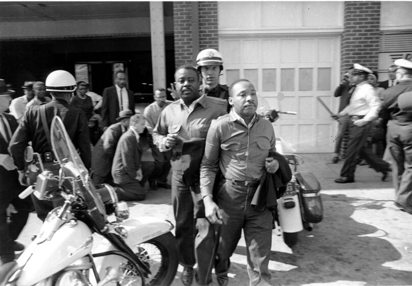 In this file photo taken April 12, 1963, the Rev. Ralph Abernathy, left, and the Rev. Martin Luther King Jr., right, are taken by a policeman as they led a line of demonstrators into the business section of Birmingham, Alabama. Arrested for leading a march against racial segregation, King spent days in solitary confinement writing his “Letter from Birmingham Jail,” which was smuggled out and stirred the world by explaining why Black people couldn’t keep waiting for fair treatment. (AP Photo)
