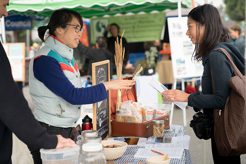 Mai Nguyen, left, talks about the importance of local grains at a farmers market in Torrance, California, on Jan. 15, 2017. Courtesy photo by Jessica Blackstock